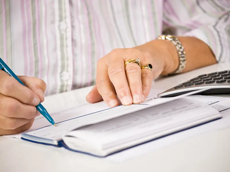 woman writing a check 