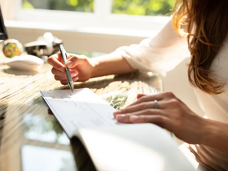 woman writing check