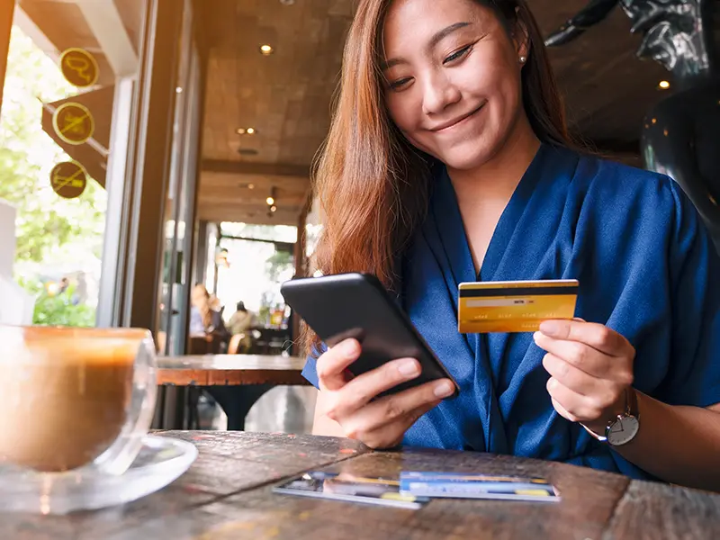 woman holding credit card