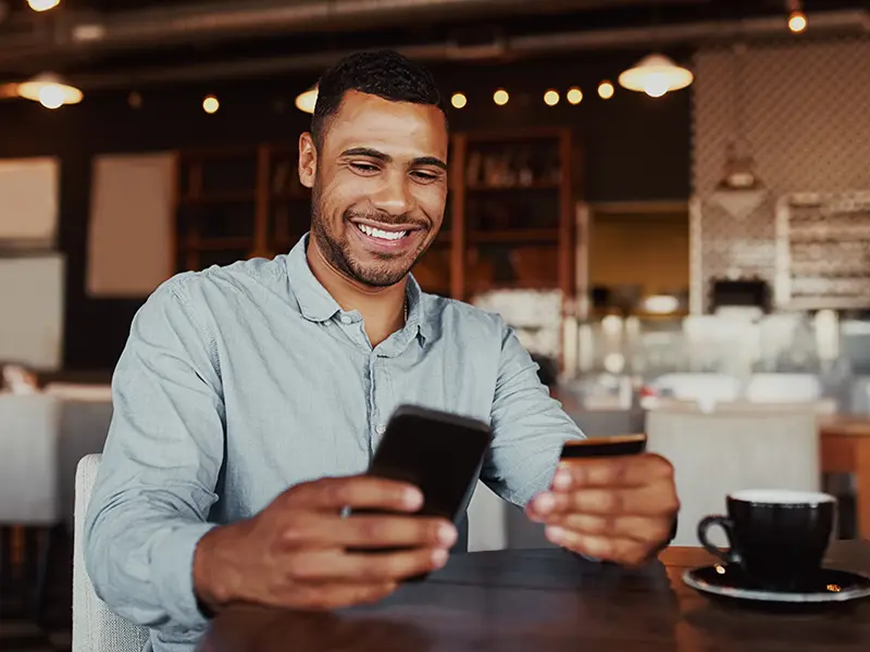 man holding credit card