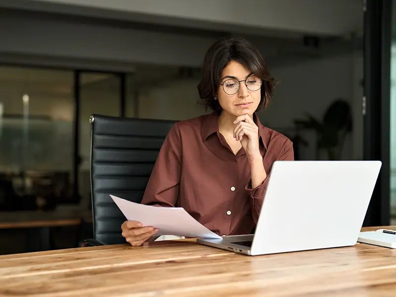 woman looking at laptop