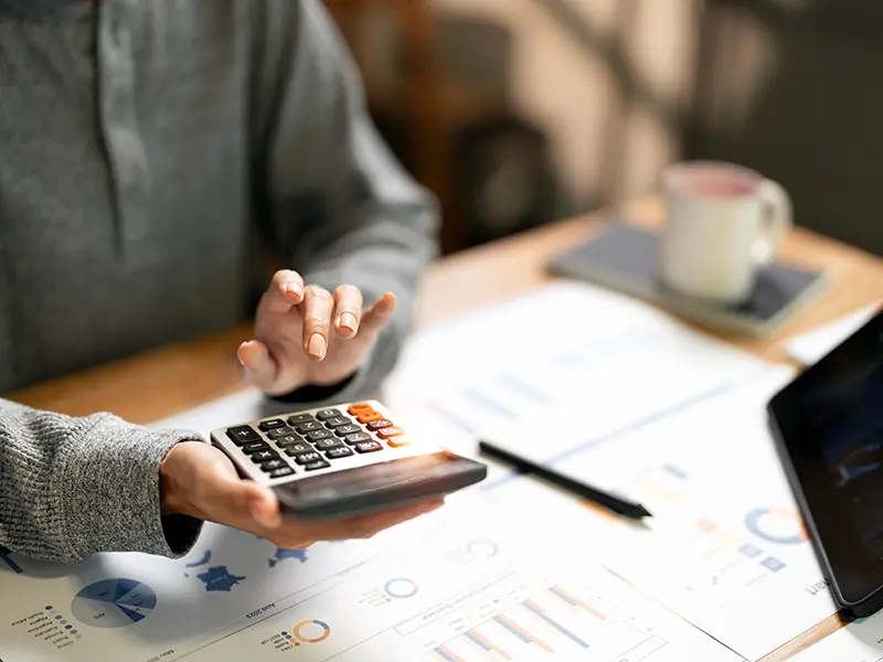 woman holding calculator